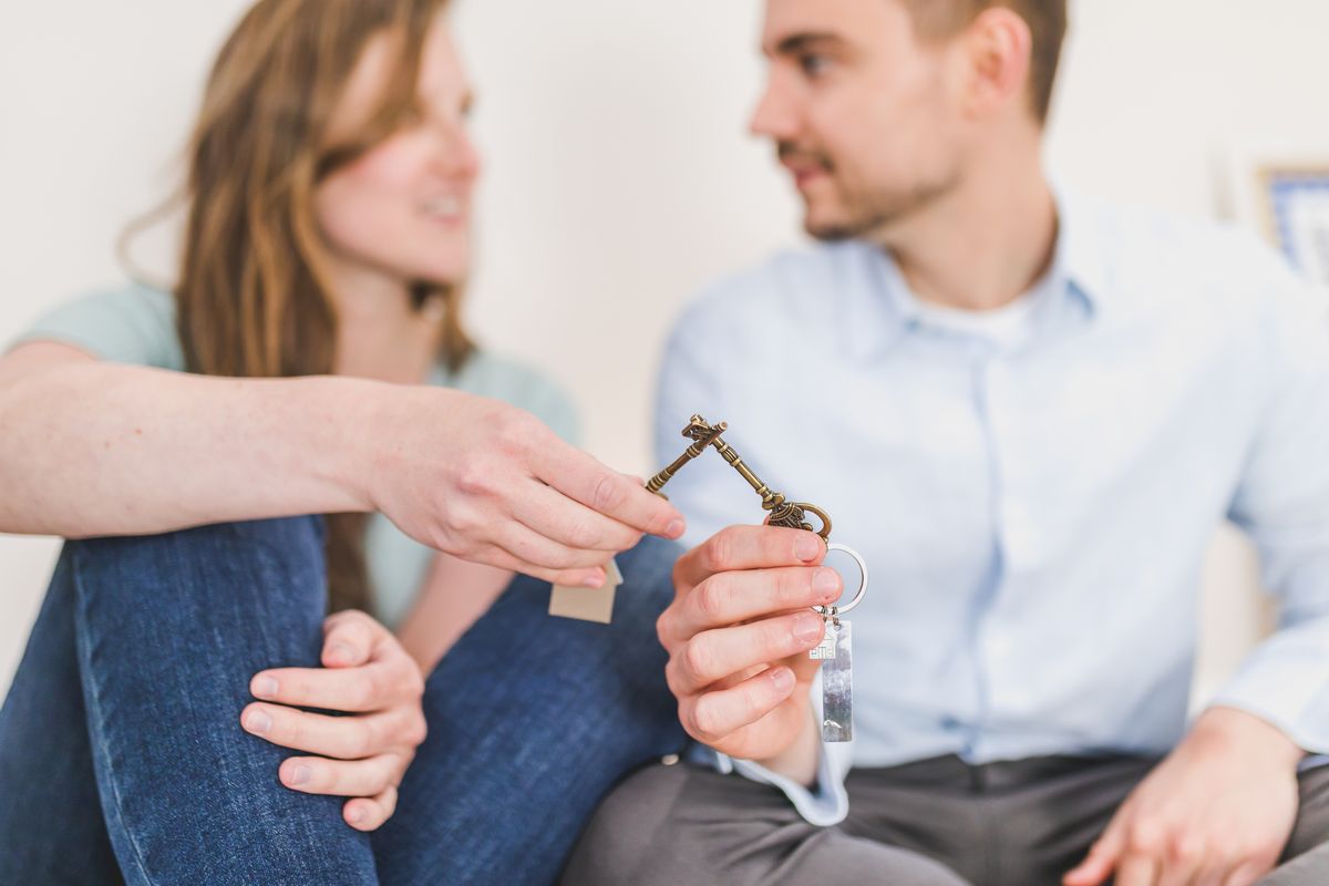 Couple receiving keys to their home