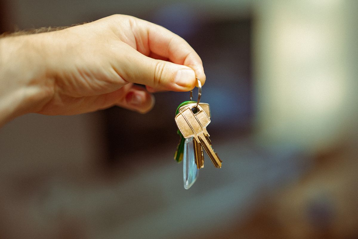 Keys being handed to a new property owner